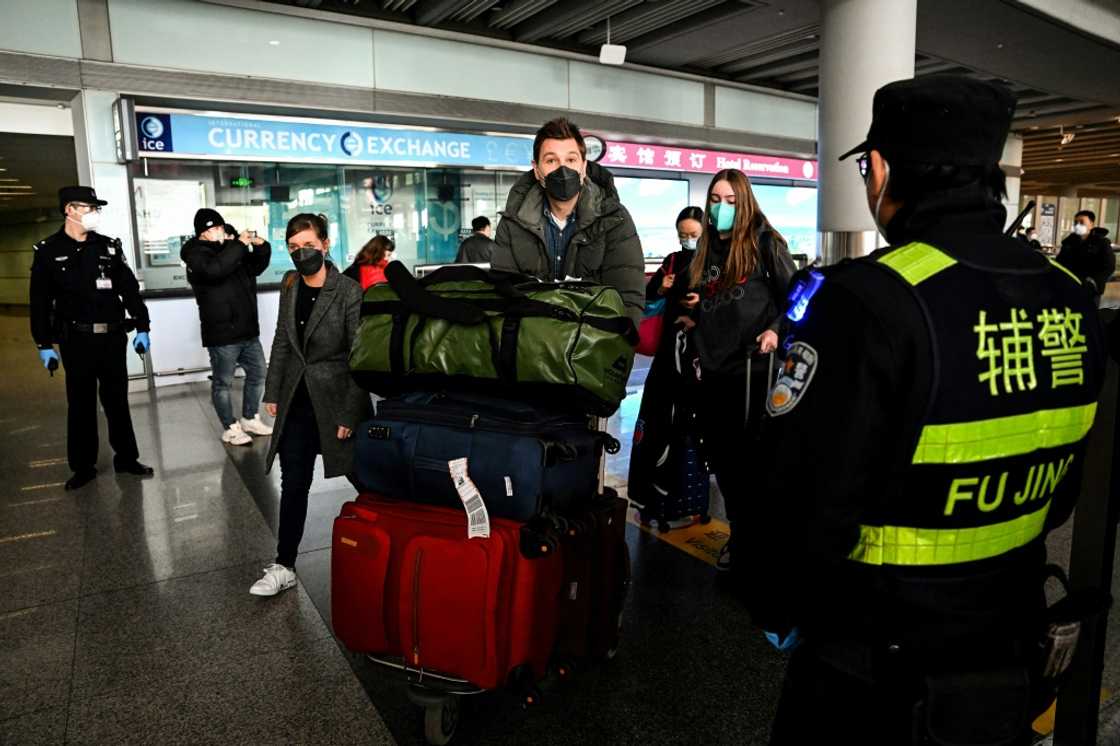 Passengers in the arrivals area at the Capital International Airport in Beijing on January 8, 2023