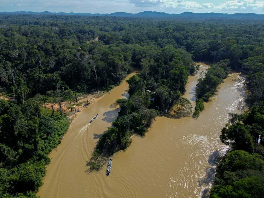 Aerial view of Porto do Arame, located on the banks of the Uraricoera river, which is the main access point for people trying to leave illegal mining sites inside Yanomami indigenous lands in Roraima state Aerial view of Porto do Arame, located on the banks of the Uraricoera river, which is the main access point for people trying to leave illegal mining sites inside Yanomami indigenous lands in Roraima state