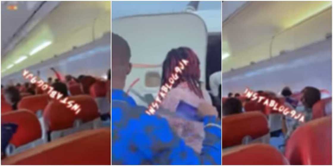 Passengers of an aircraft fanned themselves with papers Passengers of an aircraft fanned themselves with papers