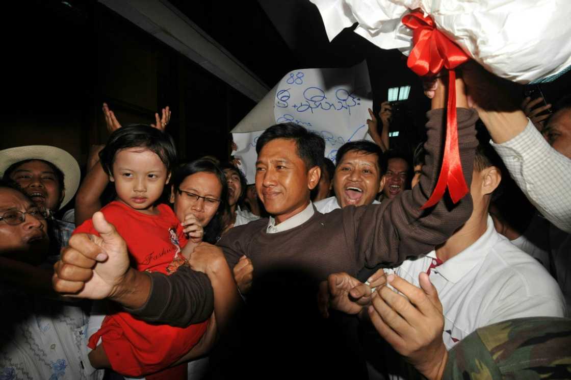 Kyaw Min Yu (centre), better known as 'Jimmy' is pictured here in 2012 alongside his wife Ni Lar Thein (left), who is holding their child