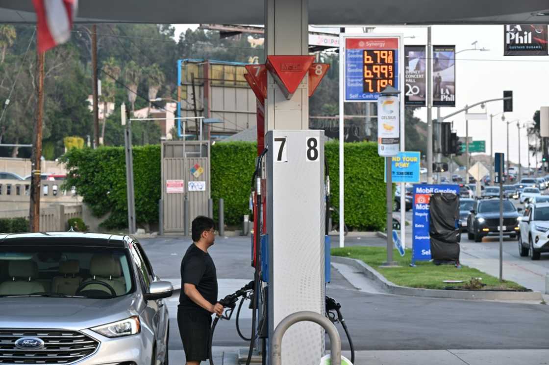 A man pumps gas at a petrol station in Los Angeles -- energy prices continue to increase in the United States A man pumps gas at a petrol station in Los Angeles -- energy prices continue to increase in the United States