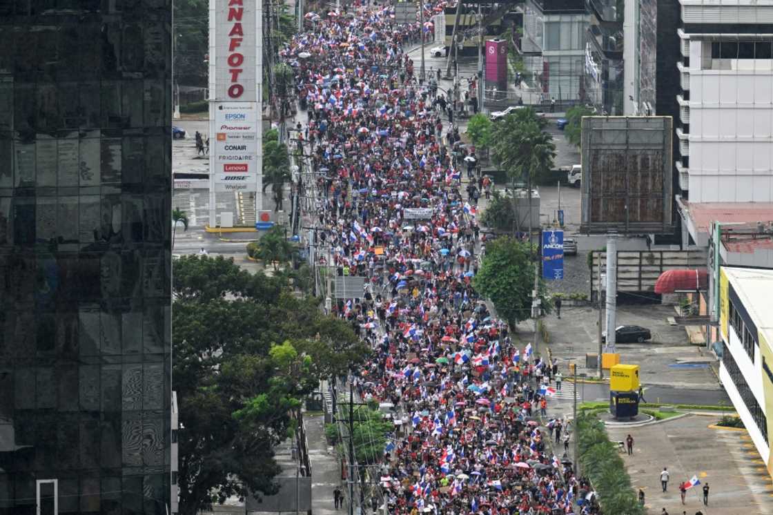 Panamanian protesters march against a government contract with a Canadian mining giant in Panama City on October 27, 2023 Panamanian protesters march against a government contract with a Canadian mining giant in Panama City on October 27, 2023