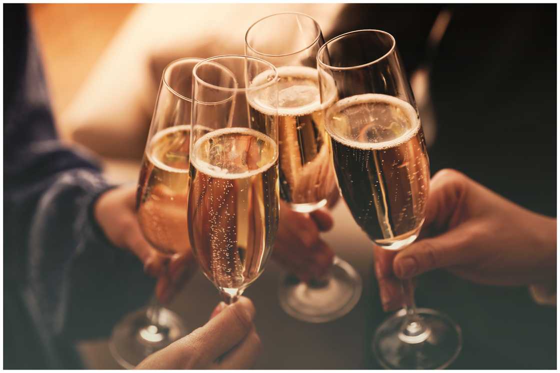 Hands of people toasting wine in the tasting room Hands of people toasting wine in the tasting room