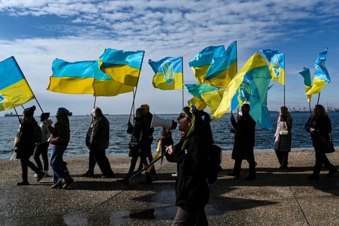 Ukrainians living in Greece wave Ukrainian flags during a demonstration in Thessaloniki on January 21, 2024 Ukrainians living in Greece wave Ukrainian flags during a demonstration in Thessaloniki on January 21, 2024