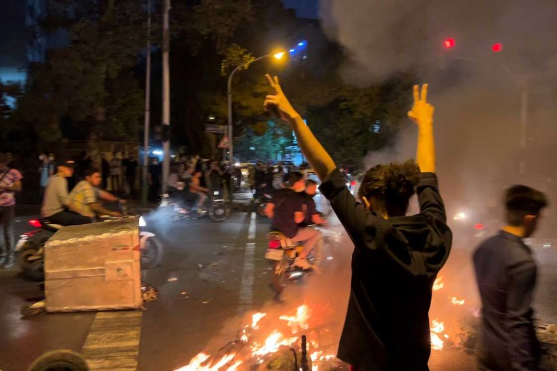 A picture obtained by AFP outside Iran shows shows a demonstrator in Tehran on September 19, 2022 A picture obtained by AFP outside Iran shows shows a demonstrator in Tehran on September 19, 2022