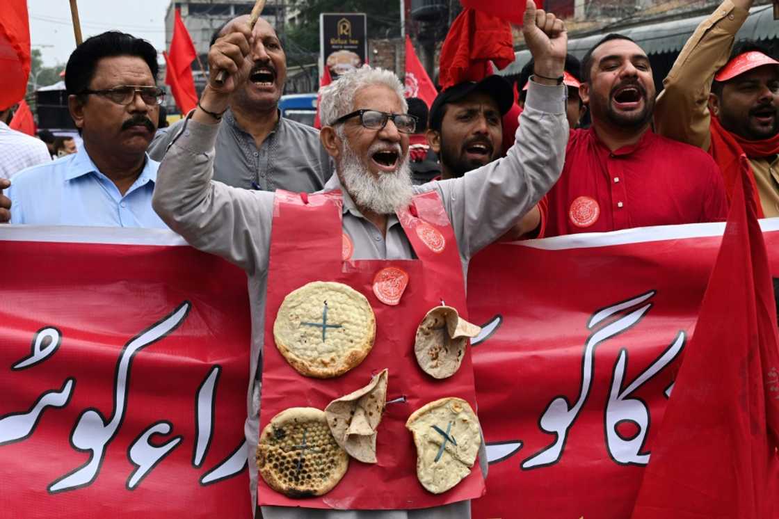 Union activists march during a May day protest in Lahore. Runaway inflation has send prices soaring for Pakistanis -- especially the poor and marginalised Union activists march during a May day protest in Lahore. Runaway inflation has send prices soaring for Pakistanis -- especially the poor and marginalised