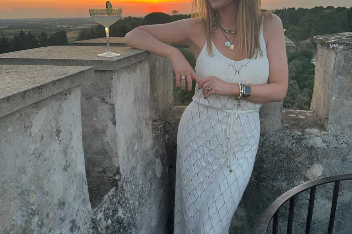 A woman is wearing a white sundress A woman is wearing a white sundress