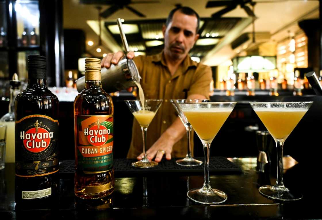 A bartender prepares a cocktail with the new Havana Club Cuban Spiced rum at Havana's rum museum in 2022 A bartender prepares a cocktail with the new Havana Club Cuban Spiced rum at Havana's rum museum in 2022