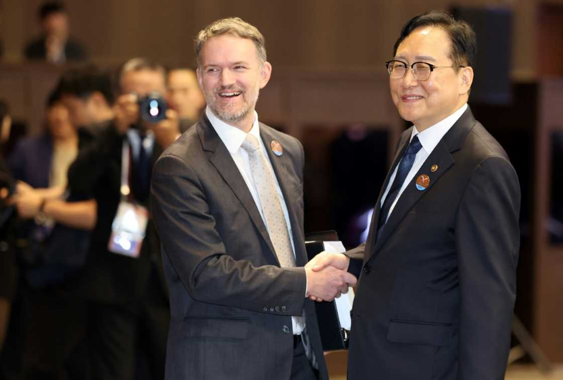 South Korean Trade Minister Cheong In-kyo (right) shakes hands with US trade representative Jamieson Greer before the opening ceremony of the Asia-Pacific Economic Cooperation 2025 Trade Ministers Meeting in Jeju South Korean Trade Minister Cheong In-kyo (right) shakes hands with US trade representative Jamieson Greer before the opening ceremony of the Asia-Pacific Economic Cooperation 2025 Trade Ministers Meeting in Jeju