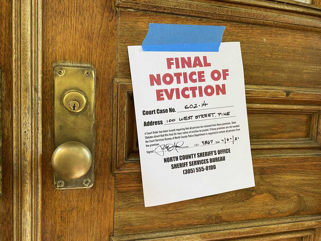 A final notice of eviction on the door. A final notice of eviction on the door.