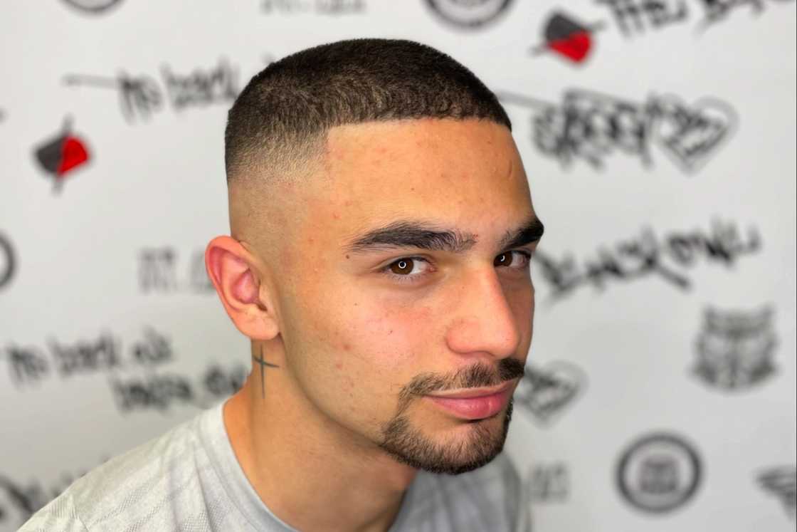 A white man is wearing a circle beard fade A white man is wearing a circle beard fade