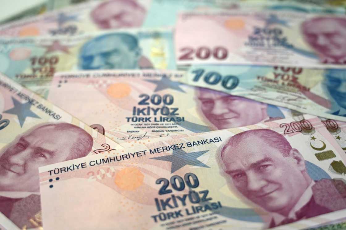 The Turkish lira fell against the dollar after a central bank hiked rates less than expected by markets