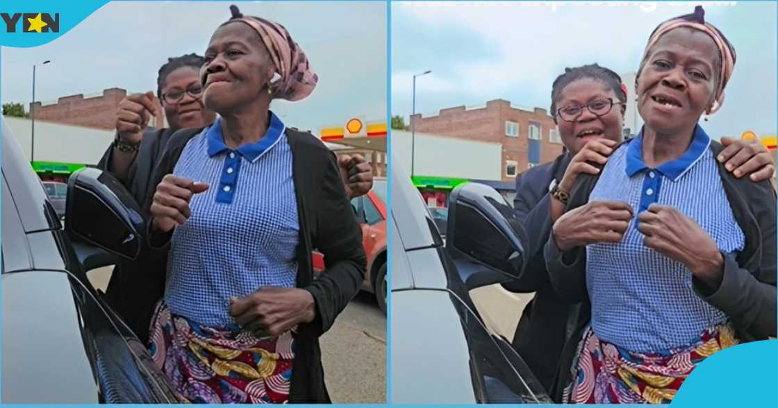 Photo of an elderly Ghanaian woman dancing with her daughter in the UK