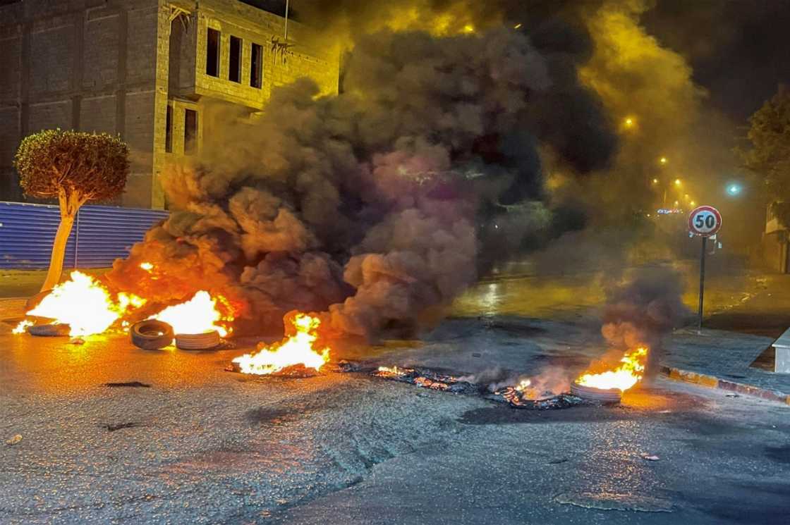 Protesters burnt car tyres to block roads in the Libyan capital Tripoli on July 4, 2022 Protesters burnt car tyres to block roads in the Libyan capital Tripoli on July 4, 2022