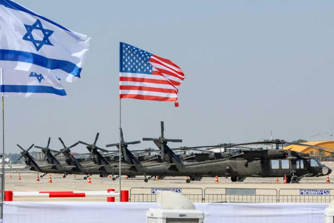 Military helicopters -- and the Israeli and US flags -- are pictured at Israel's Ben Gurion Airport ahead of US President Joe Biden's visit Military helicopters -- and the Israeli and US flags -- are pictured at Israel's Ben Gurion Airport ahead of US President Joe Biden's visit