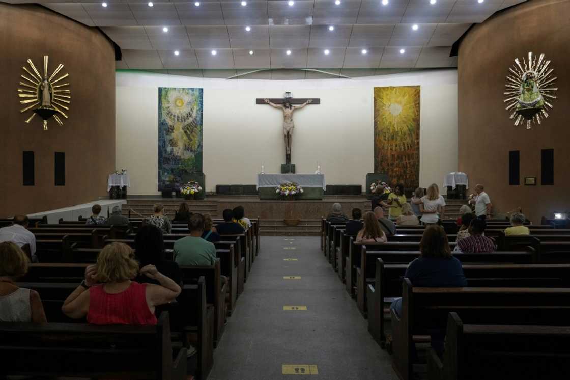 People pray at Nossa Senhora de Copacabana church, in Copacabana, Rio de Janeiro, Brazil, on October 30, 2022, during the presidential run-off election People pray at Nossa Senhora de Copacabana church, in Copacabana, Rio de Janeiro, Brazil, on October 30, 2022, during the presidential run-off election