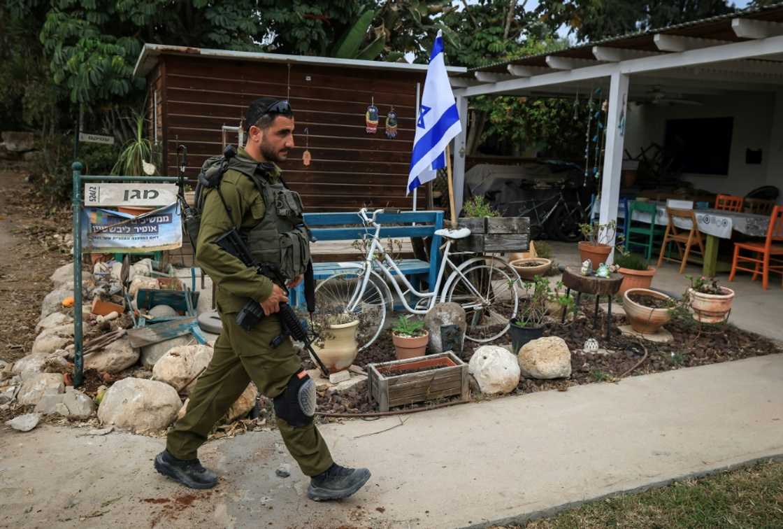 An Israeli soldier in Kibbutz Kfar Aza, which was attacked by Hamas militants, close to the southern Israeli border with the Gaza Strip on October 27, 2023 An Israeli soldier in Kibbutz Kfar Aza, which was attacked by Hamas militants, close to the southern Israeli border with the Gaza Strip on October 27, 2023