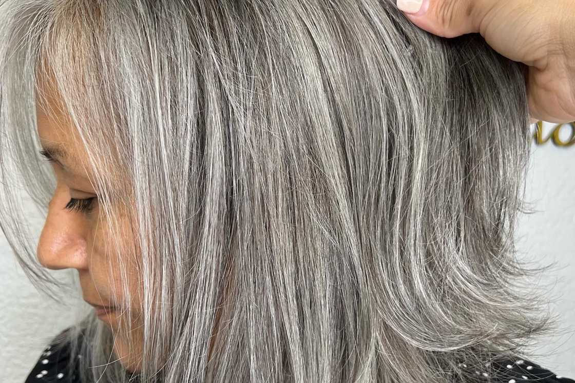Grey hair in a straight inverted bob style Grey hair in a straight inverted bob style