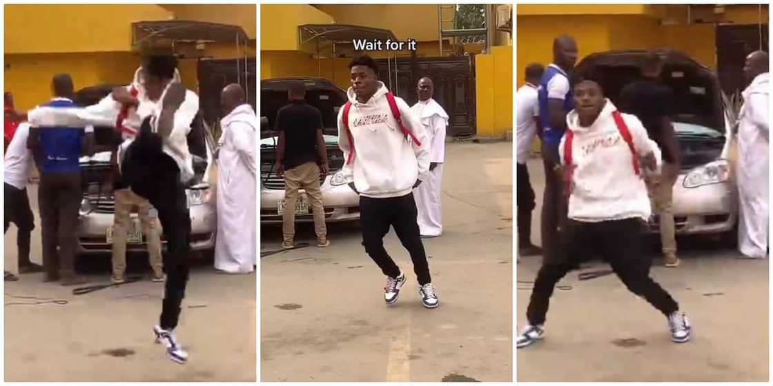 Young Nigerian man causes stir on street with sterling leg moves, distracts rev. father and mechanic in viral video Young Nigerian man causes stir on street with sterling leg moves, distracts rev. father and mechanic in viral video
