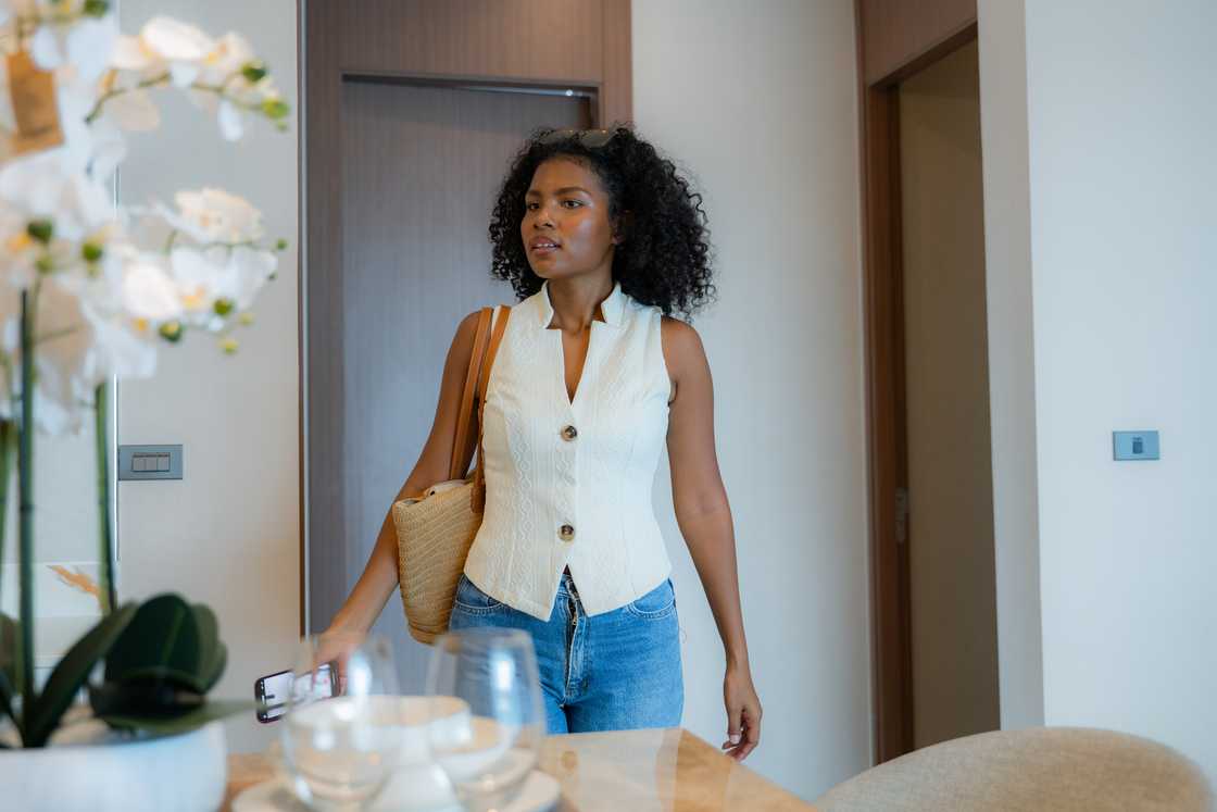 A woman checks out a new studio apartment. A woman checks out a new studio apartment.