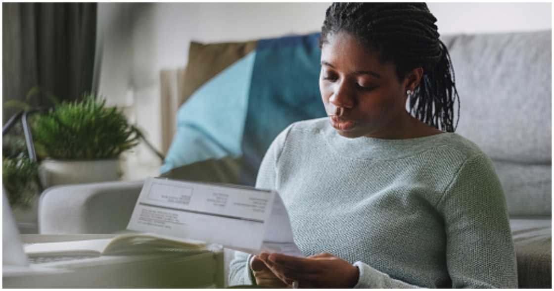 Woman checking her electricity bill