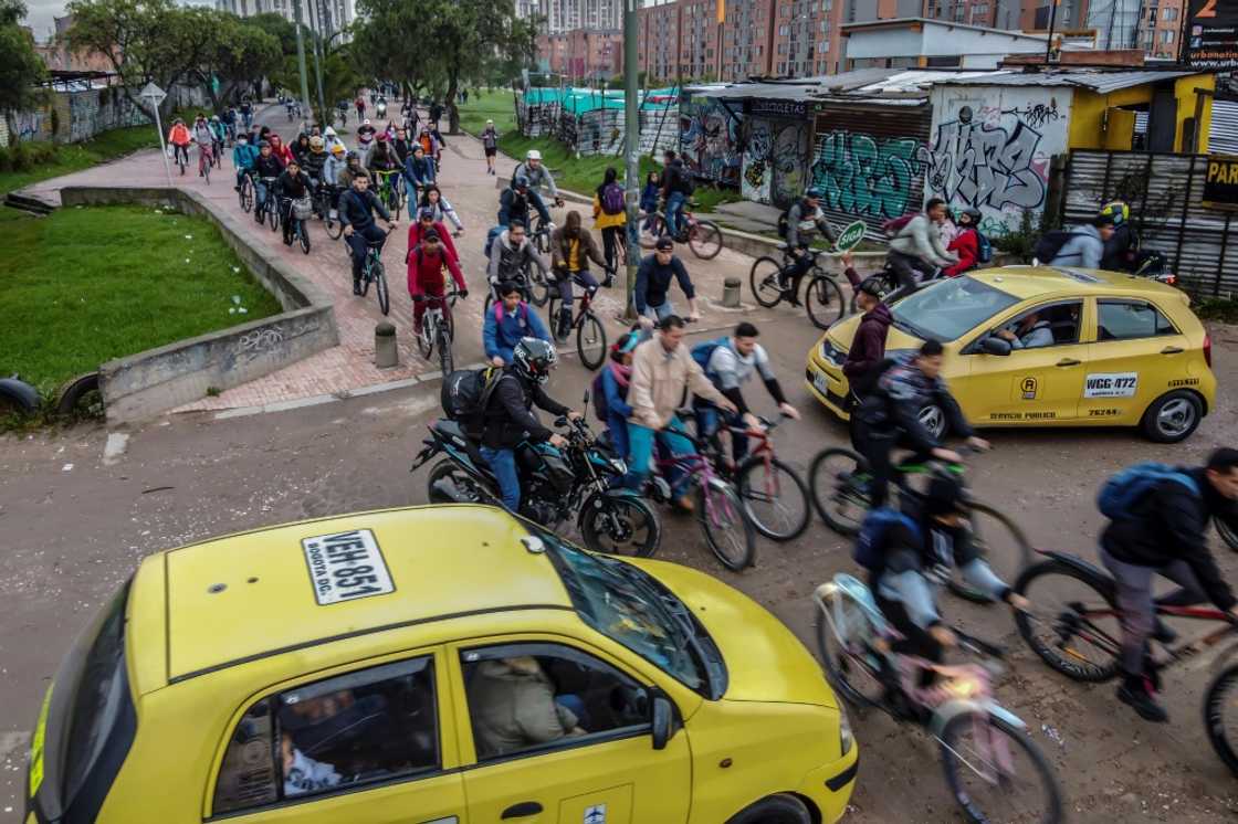 Increasing numbers of Bogota residents are using bicycles to get to work as the local government increases cycle lane infrastructure Increasing numbers of Bogota residents are using bicycles to get to work as the local government increases cycle lane infrastructure