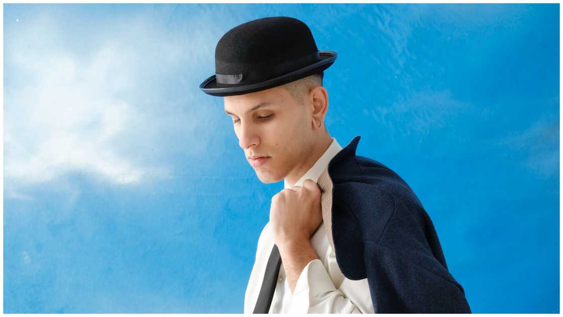 A male model posing for photos A male model posing for photos