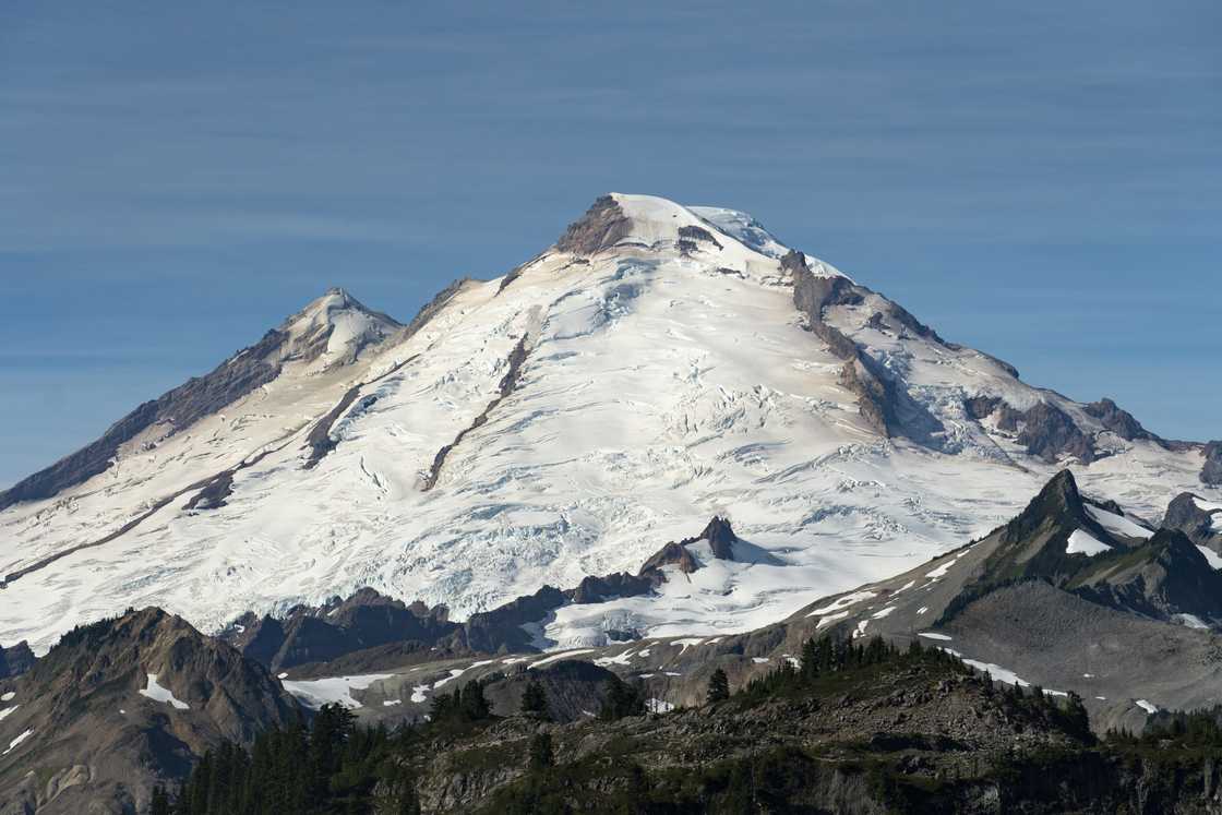 A photo of Mt Baker covered with glaciers. A photo of Mt Baker covered with glaciers.