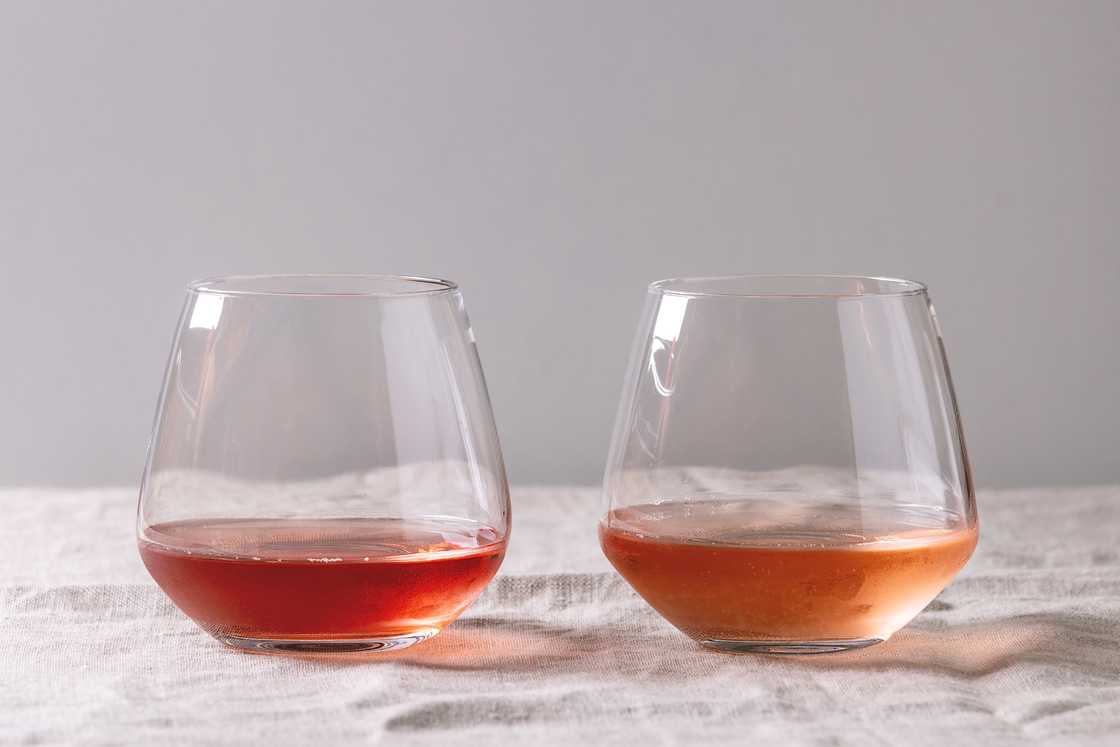 Different types of stemless wine glasses with rose wine. Different types of stemless wine glasses with rose wine.