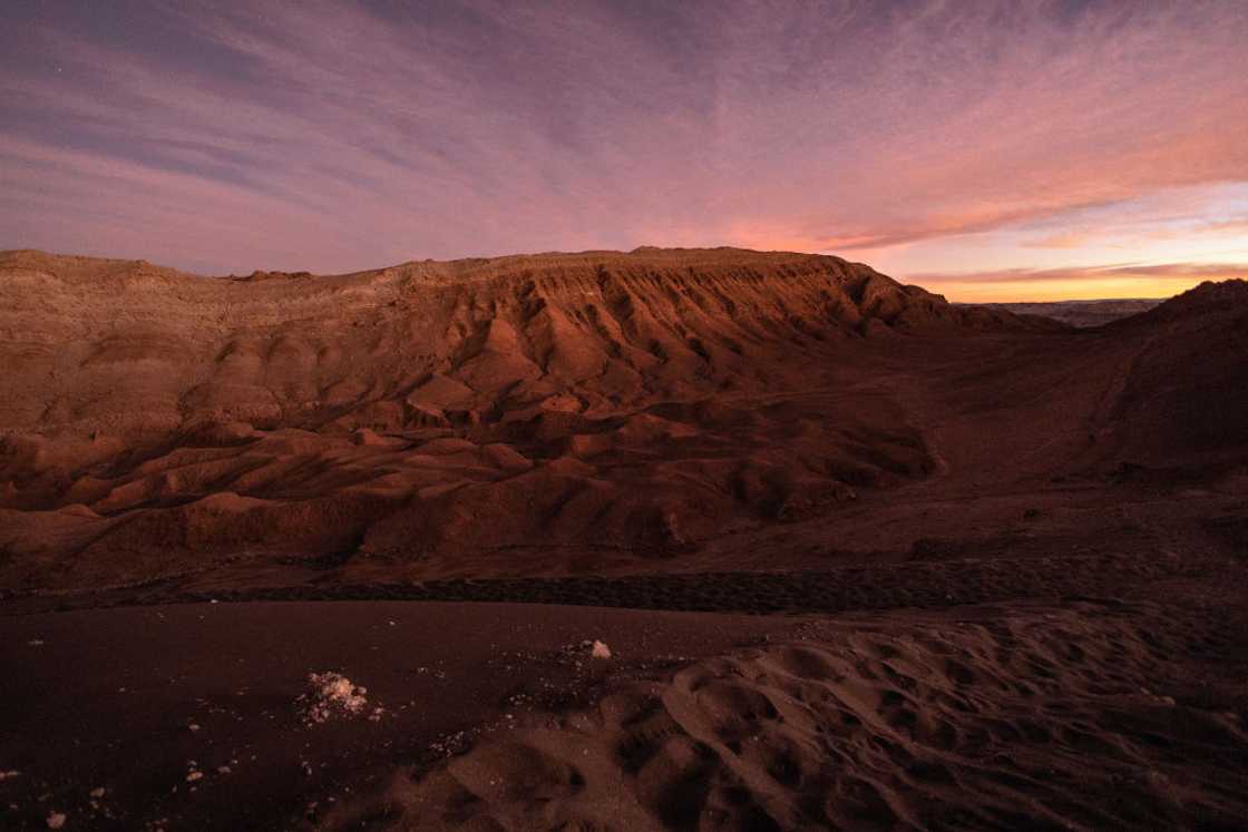 The sun sets on the Valle de la Luna in the Atacama Desert The sun sets on the Valle de la Luna in the Atacama Desert