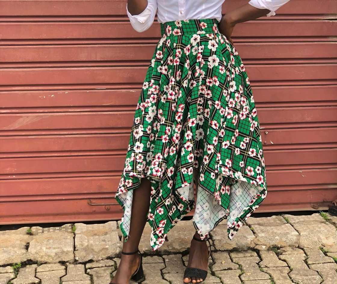 A black lady wears an African-design handkerchief skirt