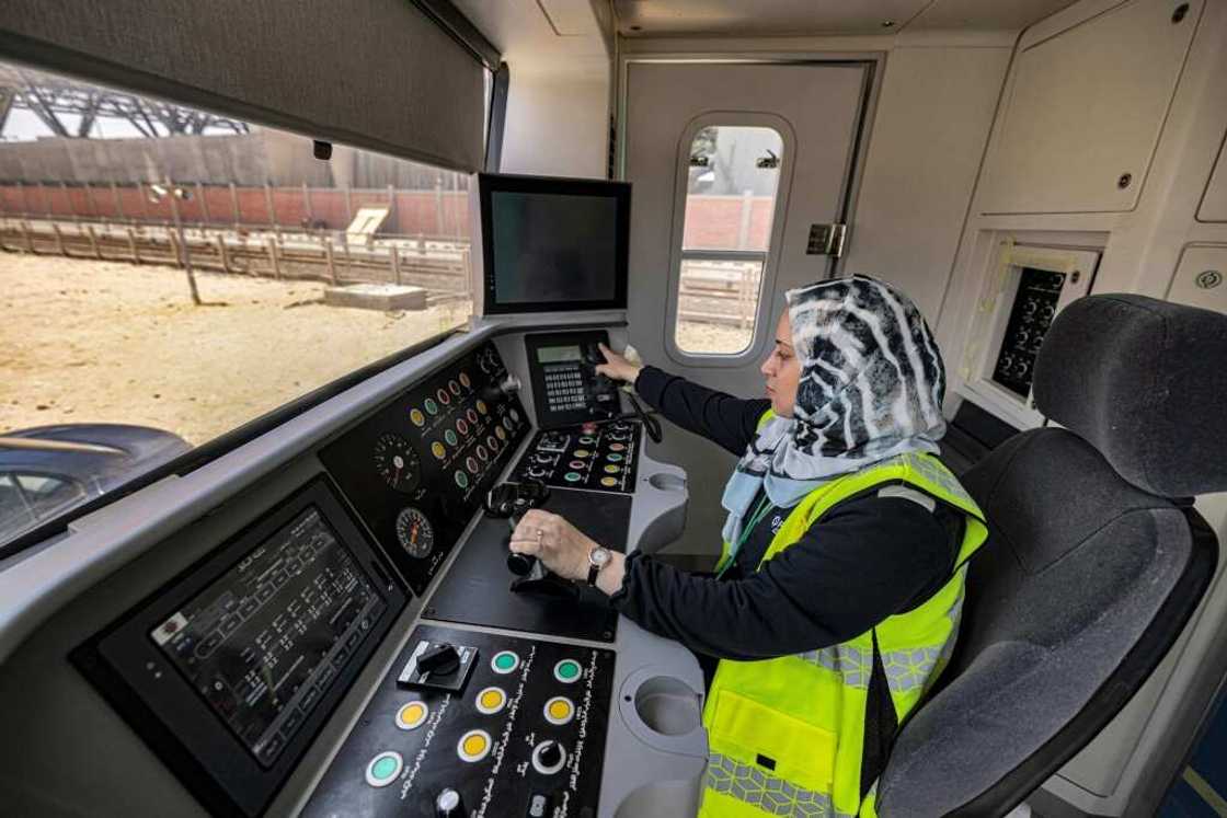 Hind Omar, shown in a full-size train simulator, is one of the first two women hired to take the controls of trains on Cairo's metro Hind Omar, shown in a full-size train simulator, is one of the first two women hired to take the controls of trains on Cairo's metro