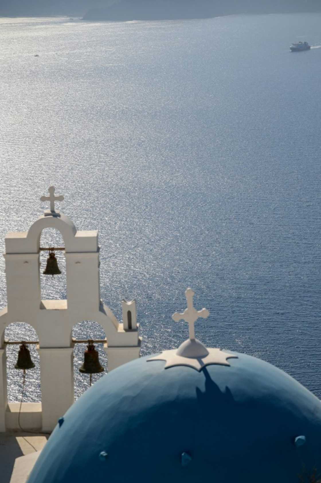 The Three Bells of Fira, the Catholic Church of the Dormition, in the village of Fira The Three Bells of Fira, the Catholic Church of the Dormition, in the village of Fira