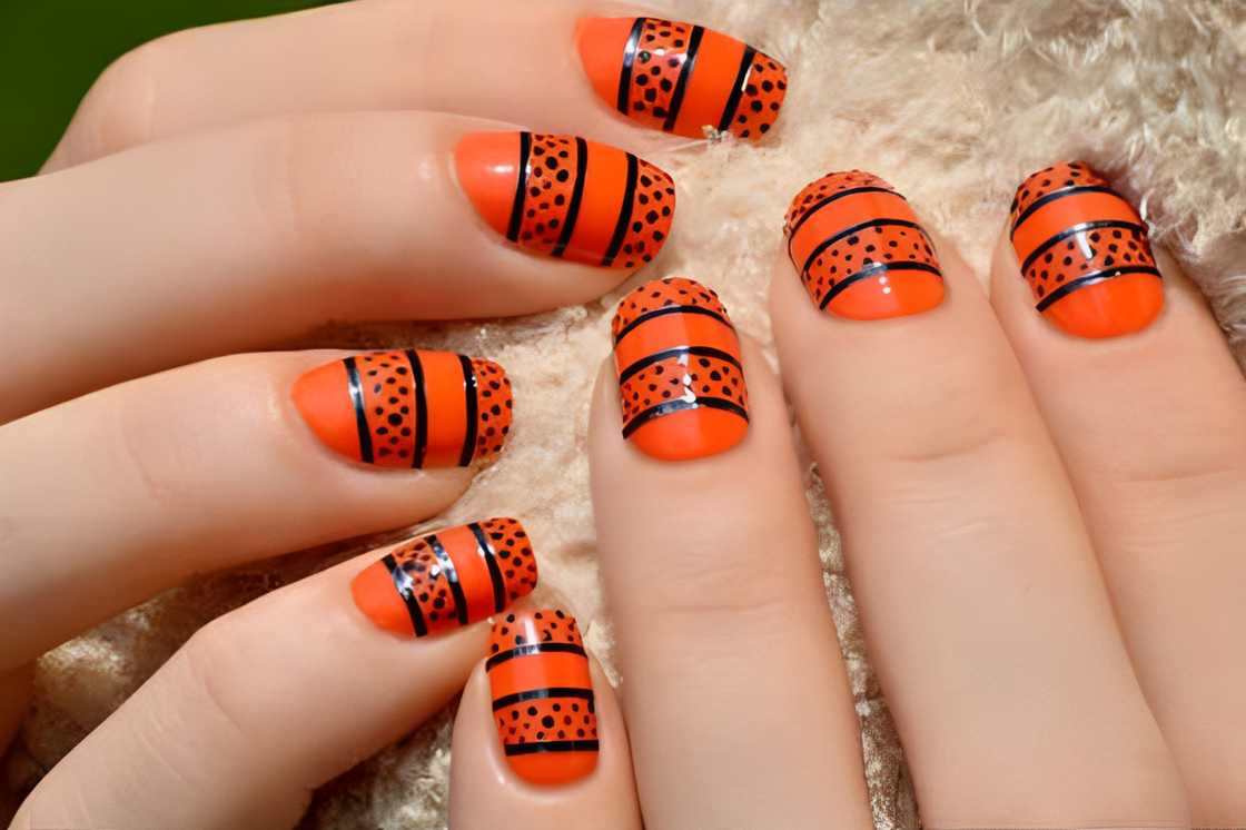 Tribal orange nails Tribal orange nails
