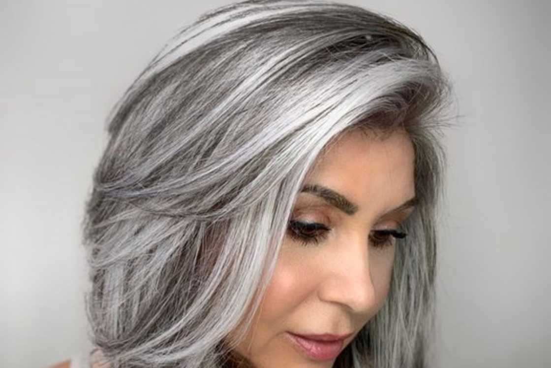 A beautiful side-swept bang with layers hairstyle with highlights A beautiful side-swept bang with layers hairstyle with highlights