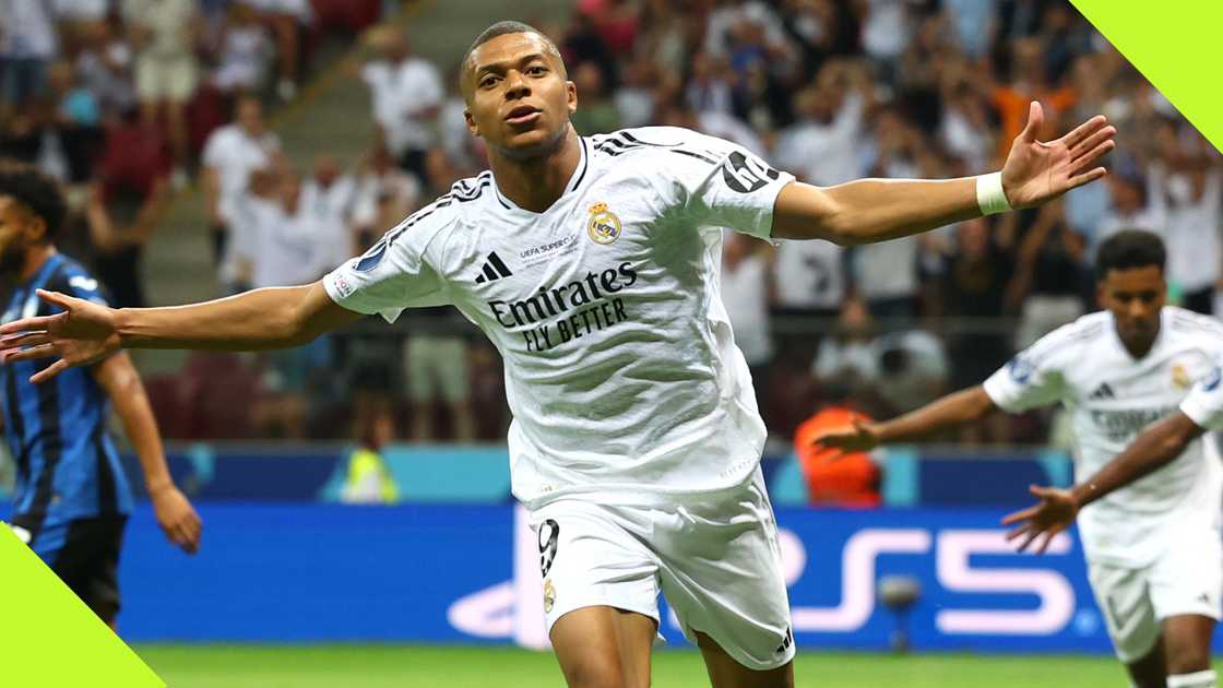 Kylian Mbappe wheels away in celebration after scoring for Real Madrid on his competitive debut for the club on August 14, 2024. Photo by Chris Brunskill/Fantasista. Kylian Mbappe wheels away in celebration after scoring for Real Madrid on his competitive debut for the club on August 14, 2024. Photo by Chris Brunskill/Fantasista.