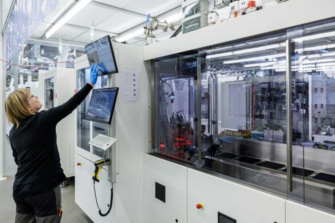 The manufacturing of solar cells is largely automated, with employees monitoring the process via computers The manufacturing of solar cells is largely automated, with employees monitoring the process via computers