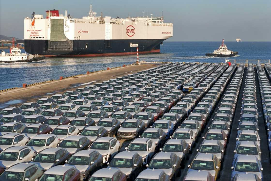 Chinese electric cars, like these waiting to be shipped for export, are at centre of trade tensions with the EU