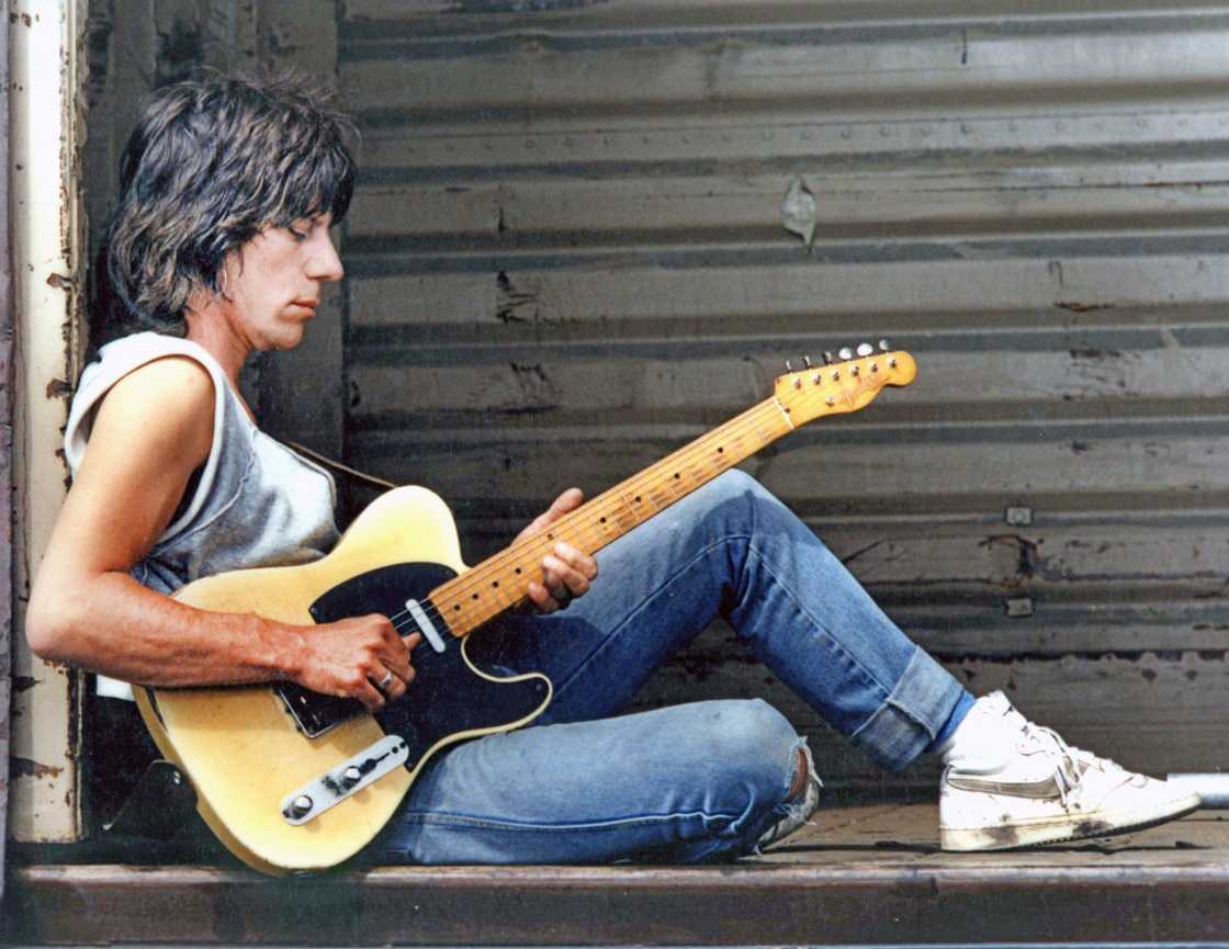 Jeff Beck, portrait playing a Fender Telecaster guitar Jeff Beck, portrait playing a Fender Telecaster guitar