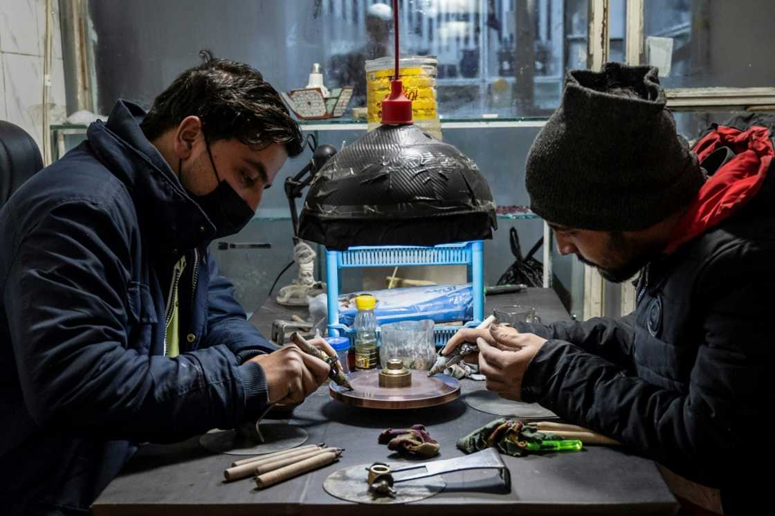 Afghan jewellers working on ruby gemstones at an engraving and goldsmith workshop in Kabul Afghan jewellers working on ruby gemstones at an engraving and goldsmith workshop in Kabul