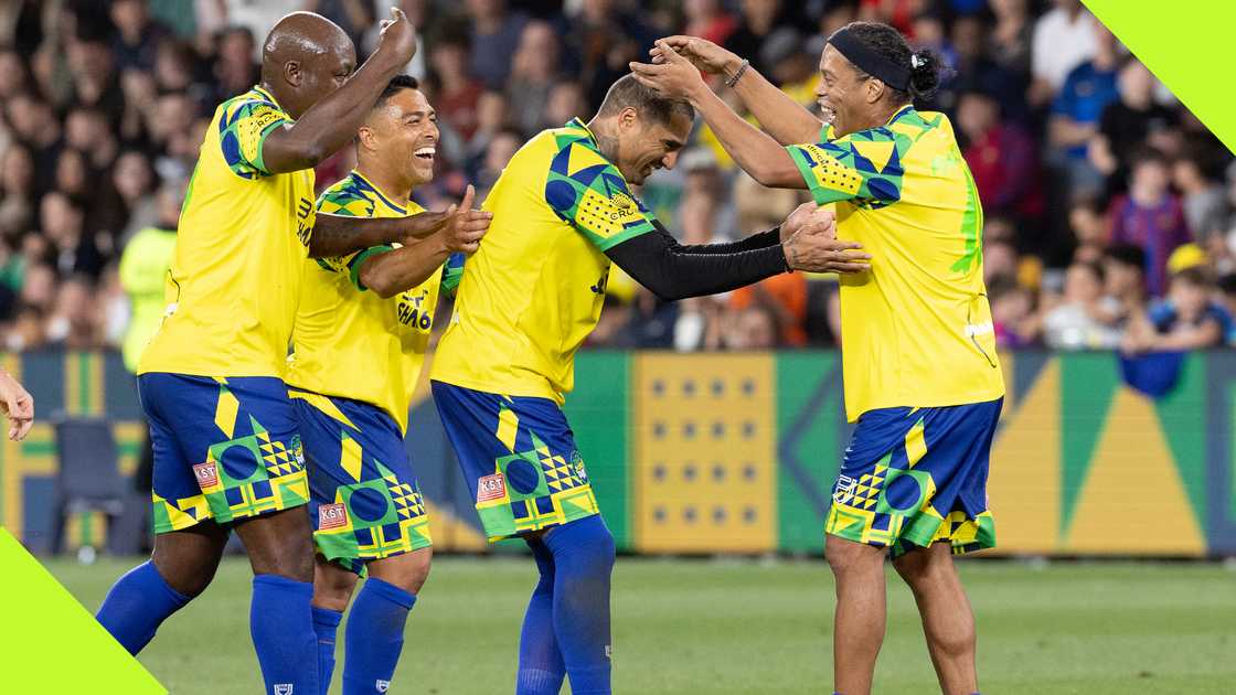 KP Boateng is mobbed by Ronaldinho and other teammates after scoring an insane goal in an exhibition game. KP Boateng is mobbed by Ronaldinho and other teammates after scoring an insane goal in an exhibition game.