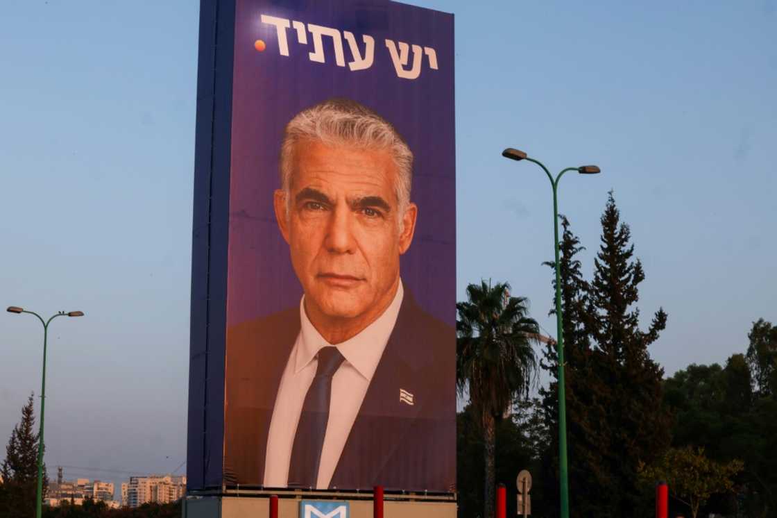 A billboard for Yesh Atid party leader Yair Lapid, under the Hebrew spelling of the party name, in Tel Aviv this week A billboard for Yesh Atid party leader Yair Lapid, under the Hebrew spelling of the party name, in Tel Aviv this week