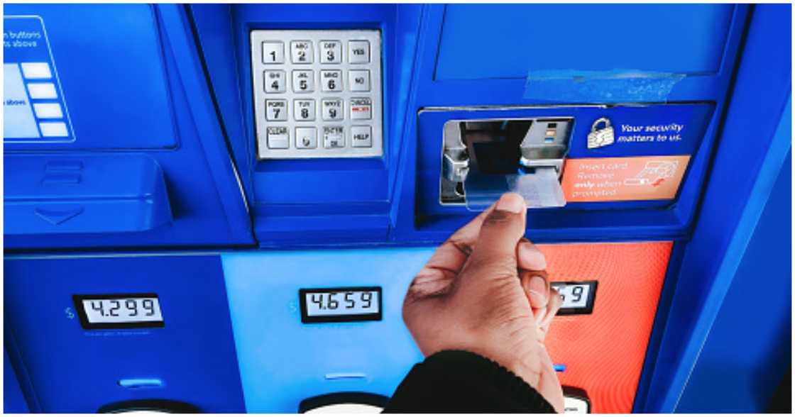 A man withdraws money from an ATM