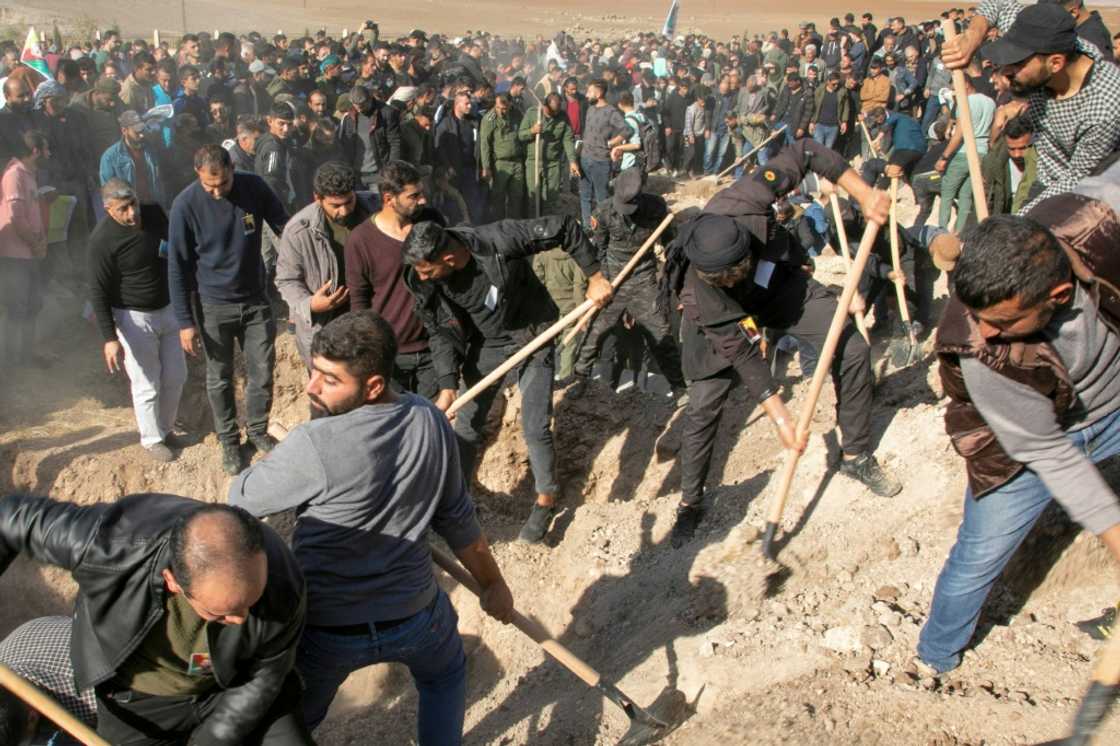 Syrian Kurds bury people killed in Turkish air strikes in al-Malikiyah in northeastern Hasakah province on November 21, 2022 Syrian Kurds bury people killed in Turkish air strikes in al-Malikiyah in northeastern Hasakah province on November 21, 2022