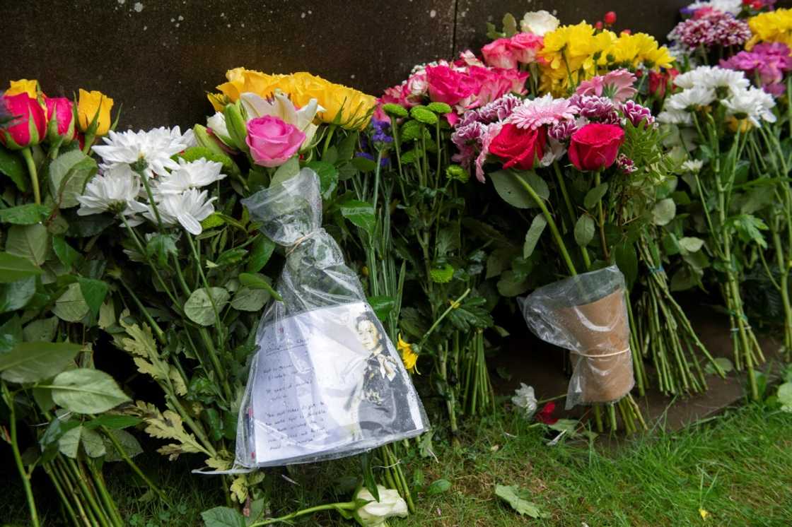 Floral tributes were also left at the queen's Windsor Castle home west of London and outside Holyroodhouse in Edinburgh Floral tributes were also left at the queen's Windsor Castle home west of London and outside Holyroodhouse in Edinburgh