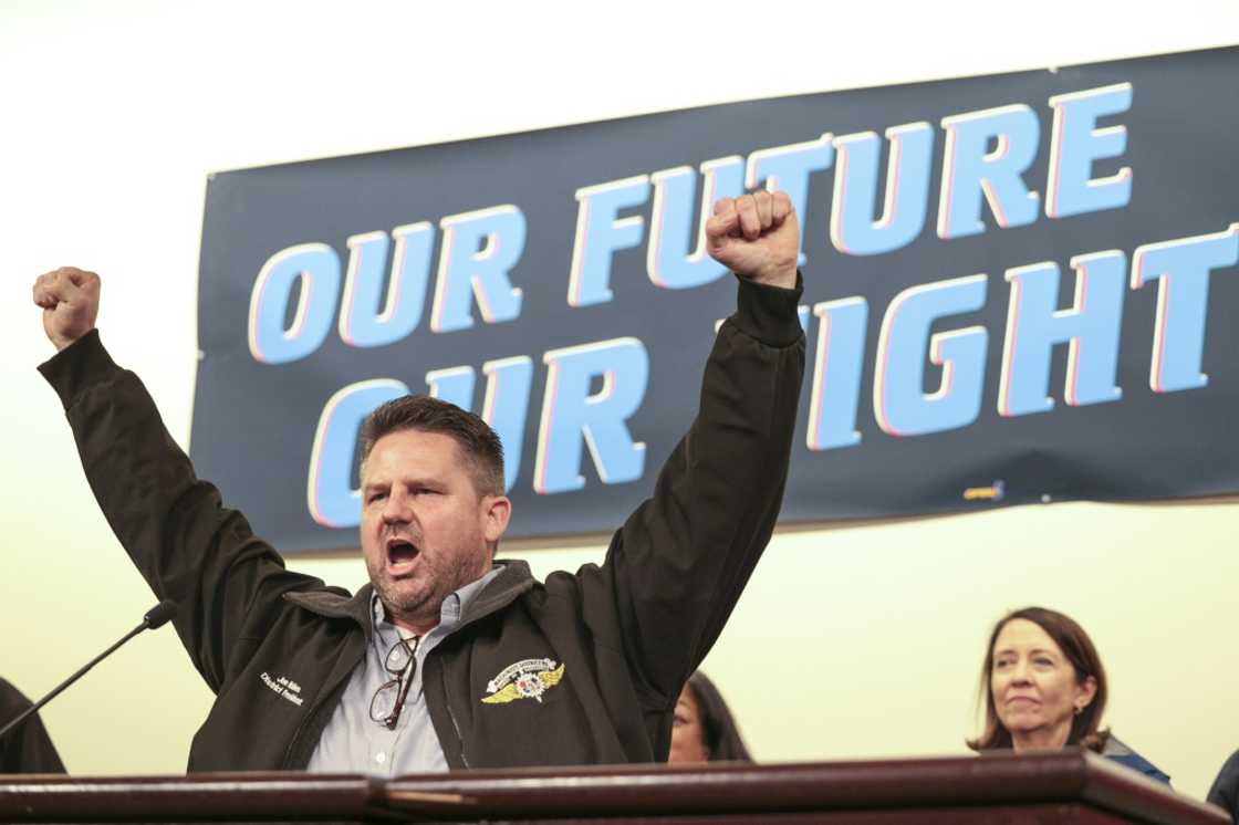 Jon Holden, president of the International Association of Machinists and Aerospace Workers (IAM) District 751, leads a cheer during a strike rally October 15, 2024 in Seattle, Washington Jon Holden, president of the International Association of Machinists and Aerospace Workers (IAM) District 751, leads a cheer during a strike rally October 15, 2024 in Seattle, Washington