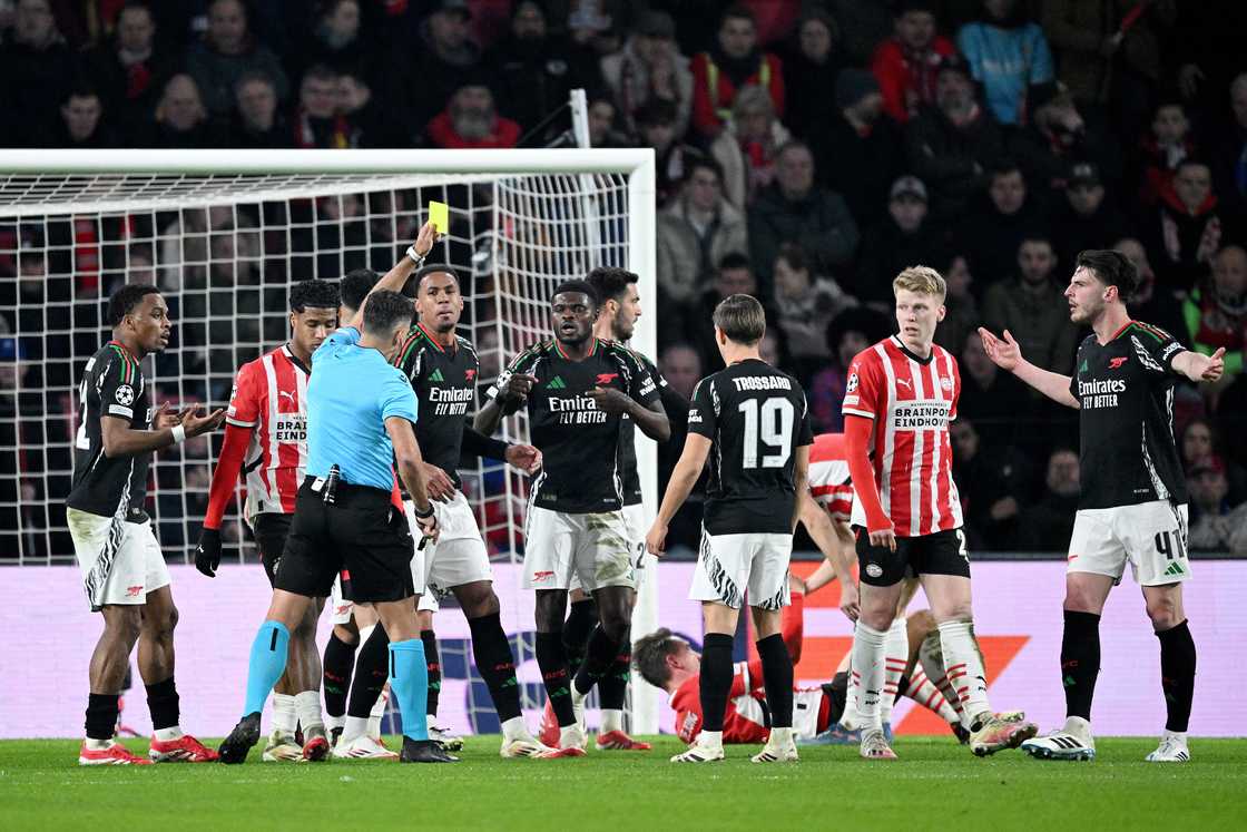 Referee Jesus Gil Manzano shows a yellow card to Thomas Partey of Arsenal, after he fouled Luuk de Jong of PSV Eindhoven resulting in a penalty kick in the PSV Eindhoven 1 Arsenal 7 2024/25 UEFA Champions League Round of 16 clash on Tuesday, March 4 Referee Jesus Gil Manzano shows a yellow card to Thomas Partey of Arsenal, after he fouled Luuk de Jong of PSV Eindhoven resulting in a penalty kick in the PSV Eindhoven 1 Arsenal 7 2024/25 UEFA Champions League Round of 16 clash on Tuesday, March 4