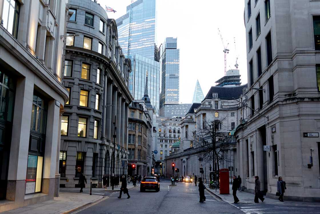 The picture shows early morning commuters making their way to work at sunrise The picture shows early morning commuters making their way to work at sunrise