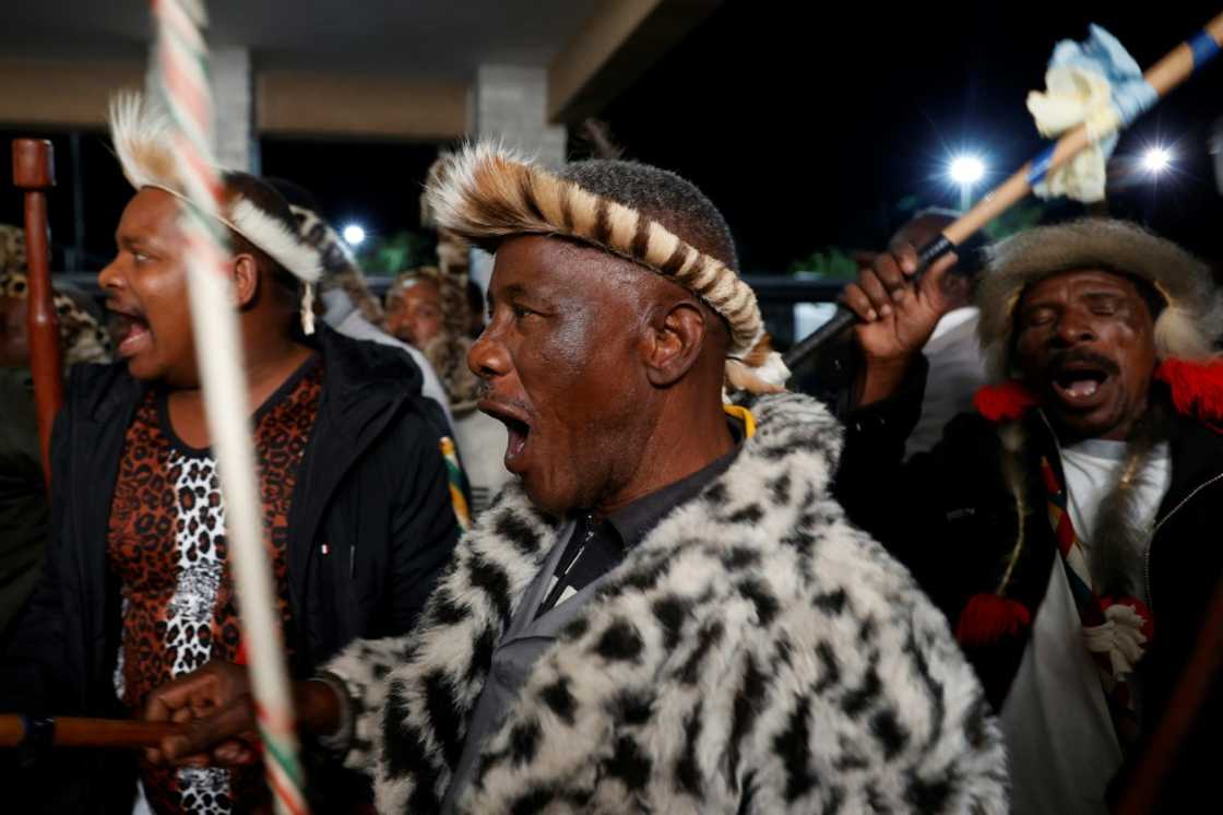 Amabutho (Zulu regiments) sing praises as they wiat for the new king to arrive