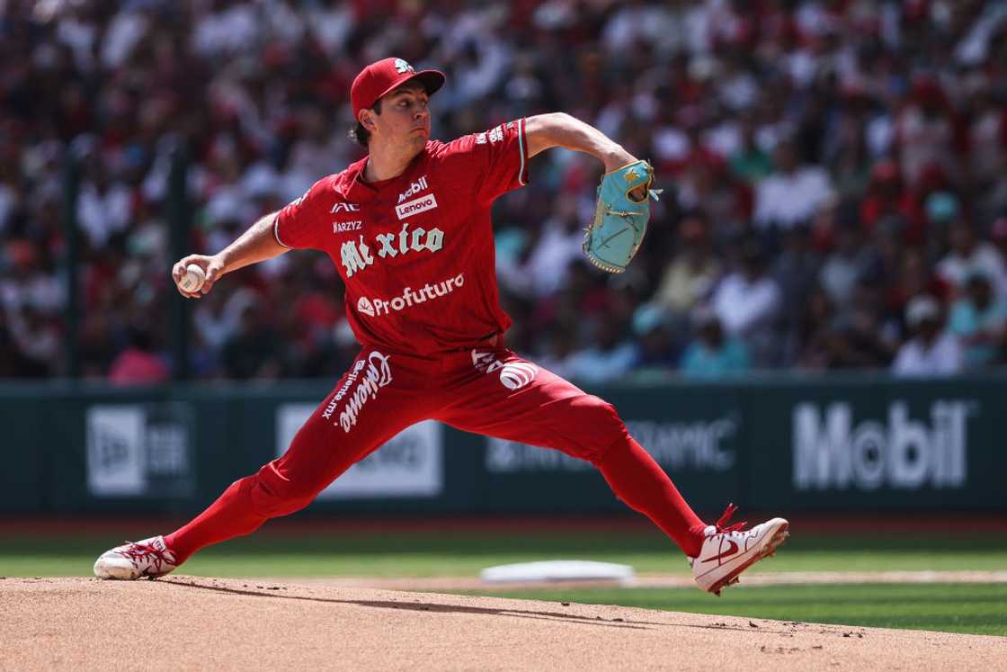 Trevor Bauer pitching in a match while playing for Diablos Rojos vs New York Yankees Trevor Bauer pitching in a match while playing for Diablos Rojos vs New York Yankees
